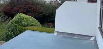 New flat roof on a rendered extension