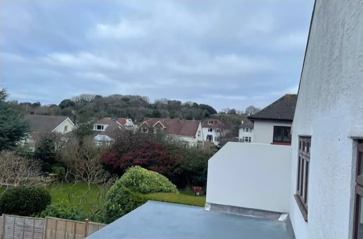 Finished flat roof on a rendered extension