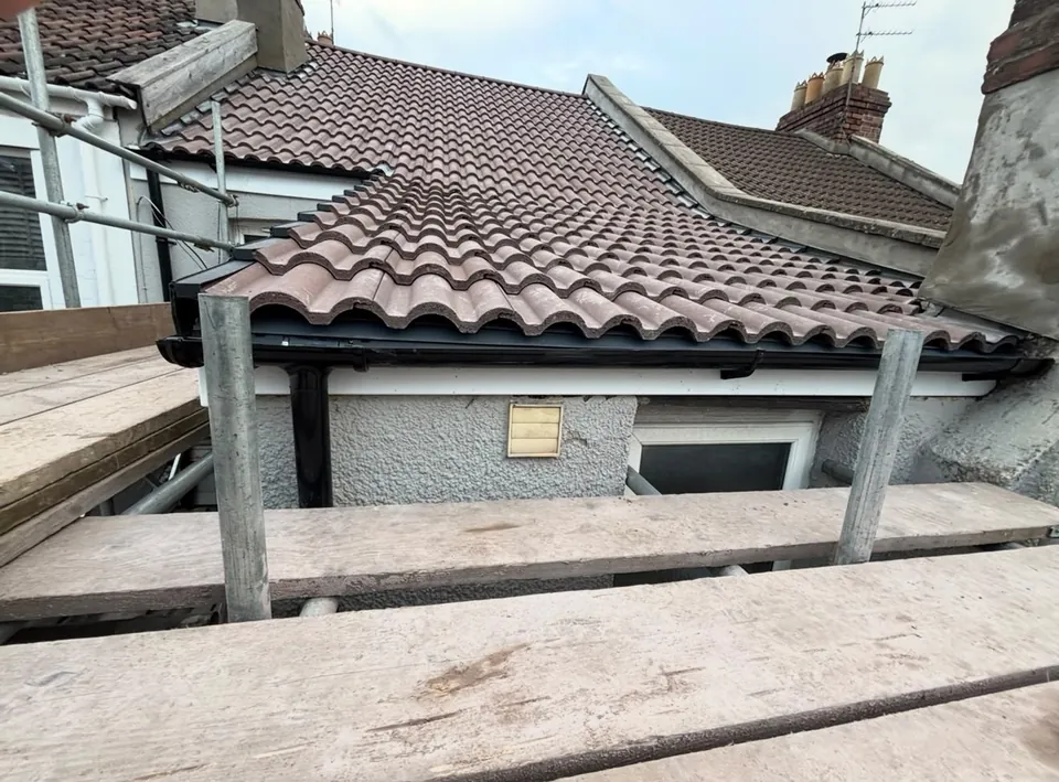 Tiled roof finished behind the scaffold