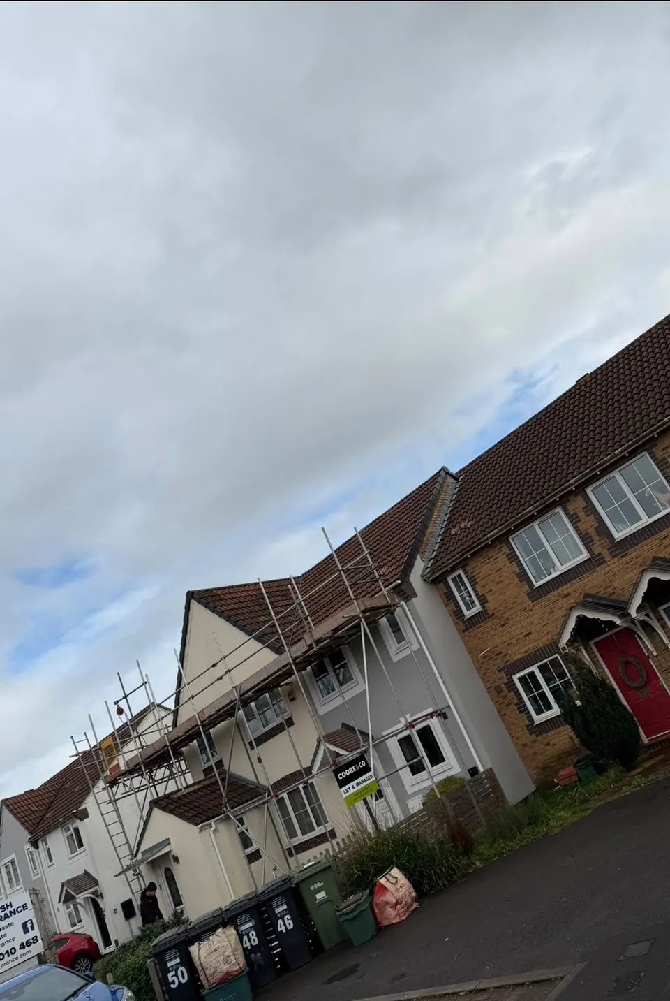 Terraced houses scaffolded for a re-roof