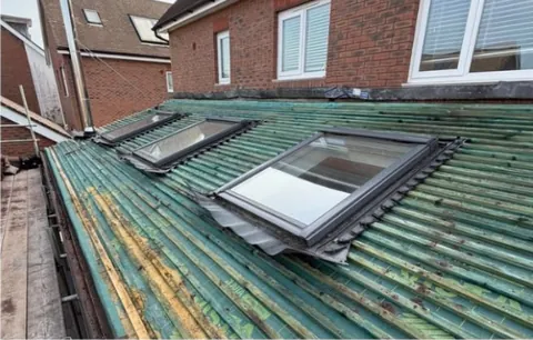 Roof stripped around the old windows